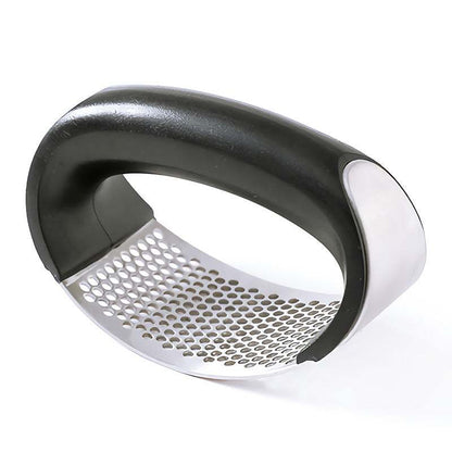 best garlic crusher featuring a stainless steel rocker with a black ergonomic handle and perforated crushing surface for easy mincing