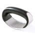 best garlic crusher featuring a stainless steel rocker with a black ergonomic handle and perforated crushing surface for easy mincing