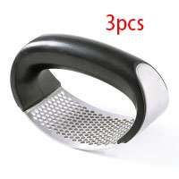 best garlic crusher stainless steel manual rocker with black handle and perforated metal surface for crushing garlic