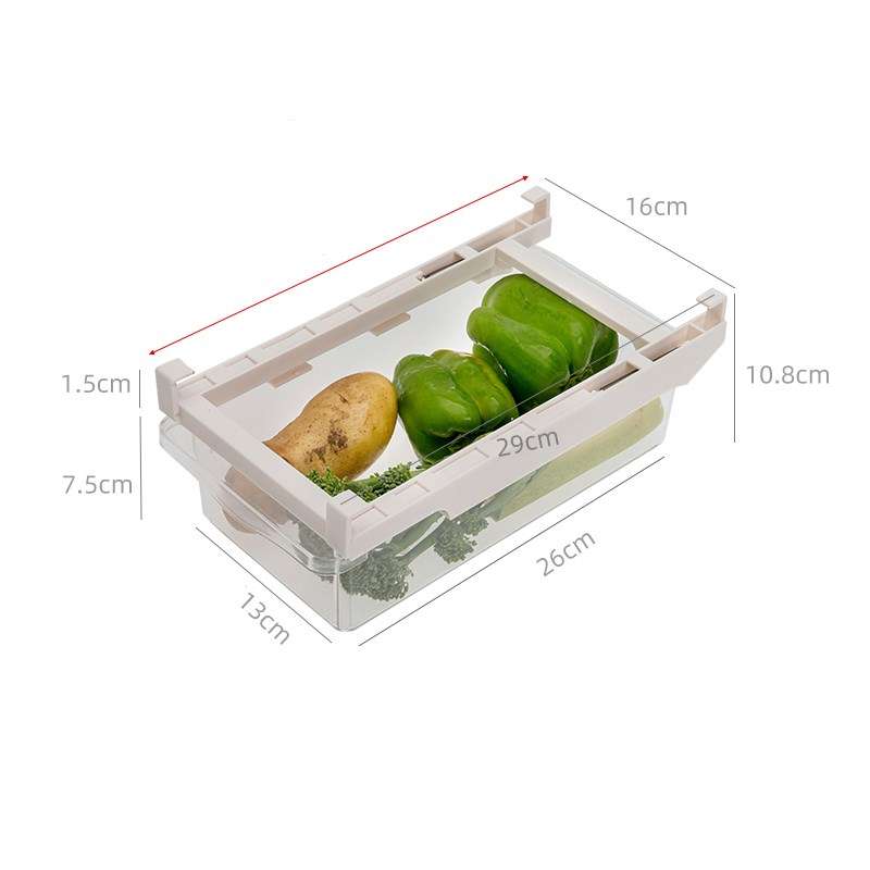 Under-Shelf Pull-Out fridge drawer organizer with clear plastic container and white frame holding green bell peppers, potato, and parsley